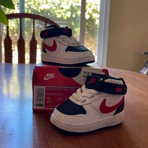 Nike baby shoes. Size 2c. Never worn.